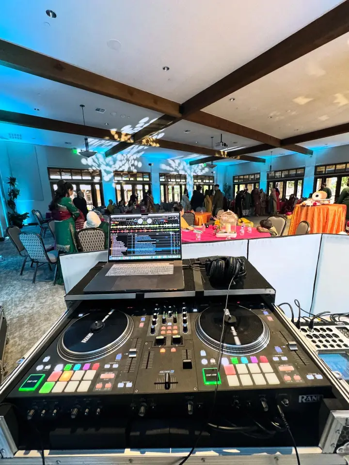 DJ booth with blue uplighting